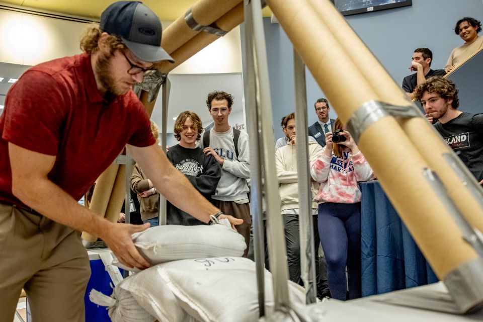 School of Science and Engineering students construct a bridge out of cardboard and duct tape during the SSE Innovation Challenge with industry partner TWM on November 13, 2024. 