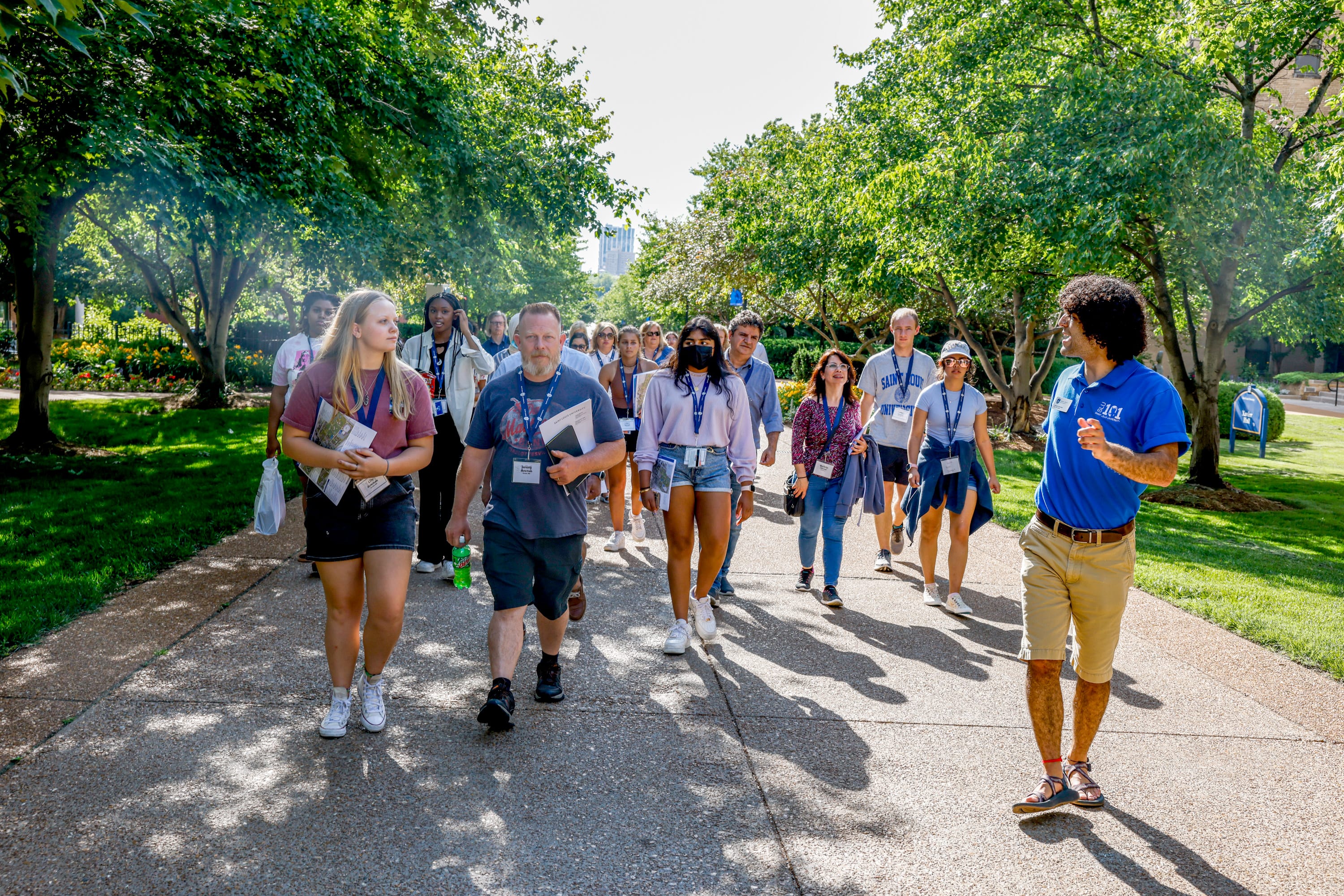 Students following their group leader on a tour of campus