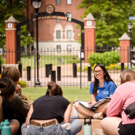 Students sitting with their group leaders during SLU 101