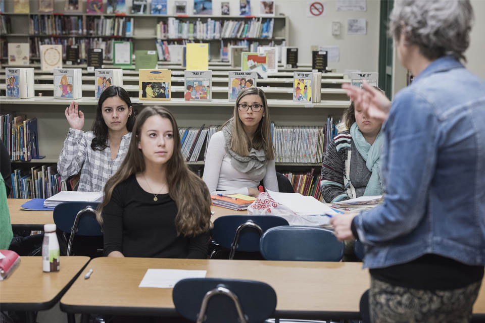 Education students in grade school classroom