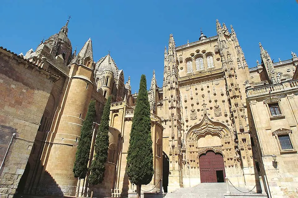 Exterior shot of the buildings of Salamanca, from the Renaissance era with arches and spires.