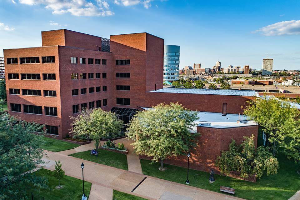 An aerial photo of SLU's nursing school on a bright sunny day.