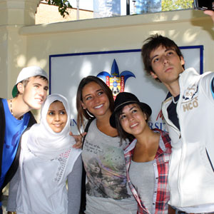 Students stop for a selfie outside of Padre Rubio Hall.