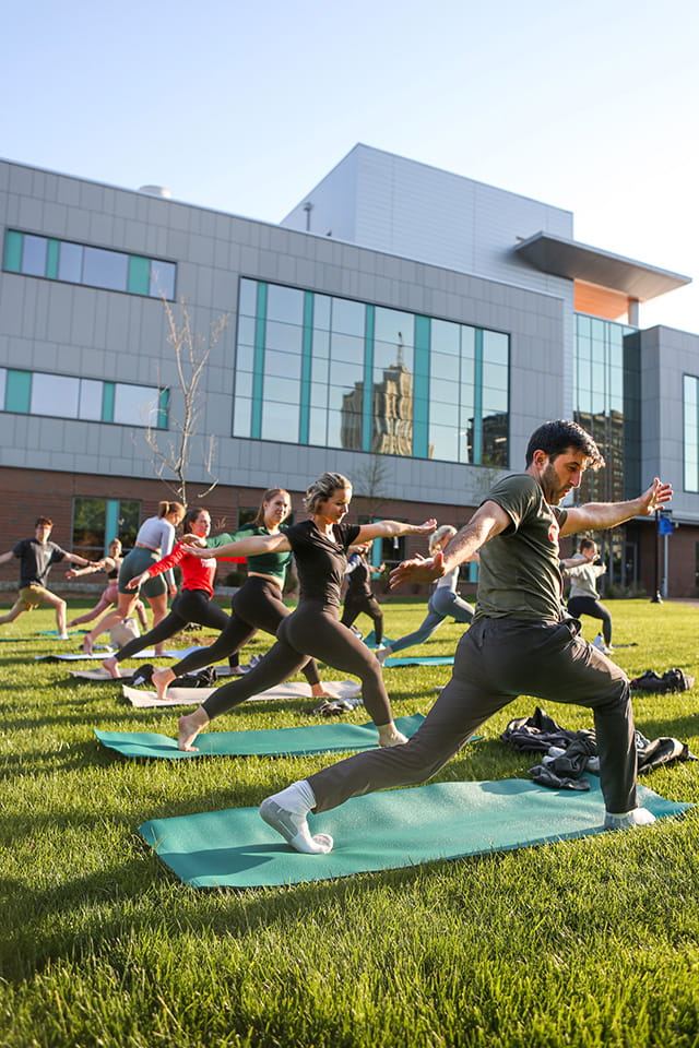Outdoor yoga practice SLU community members practice yoga outdoors